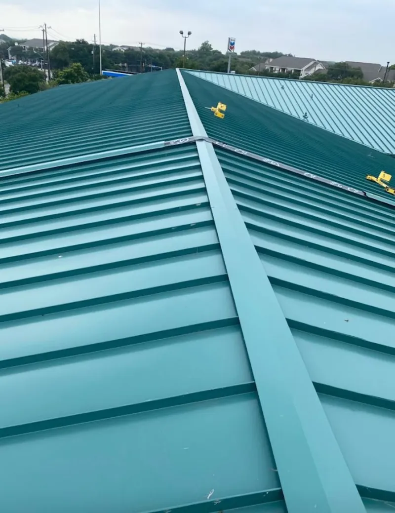 Green commercial metal roof ridge and valley for Metal Roof Repair in St. Helens